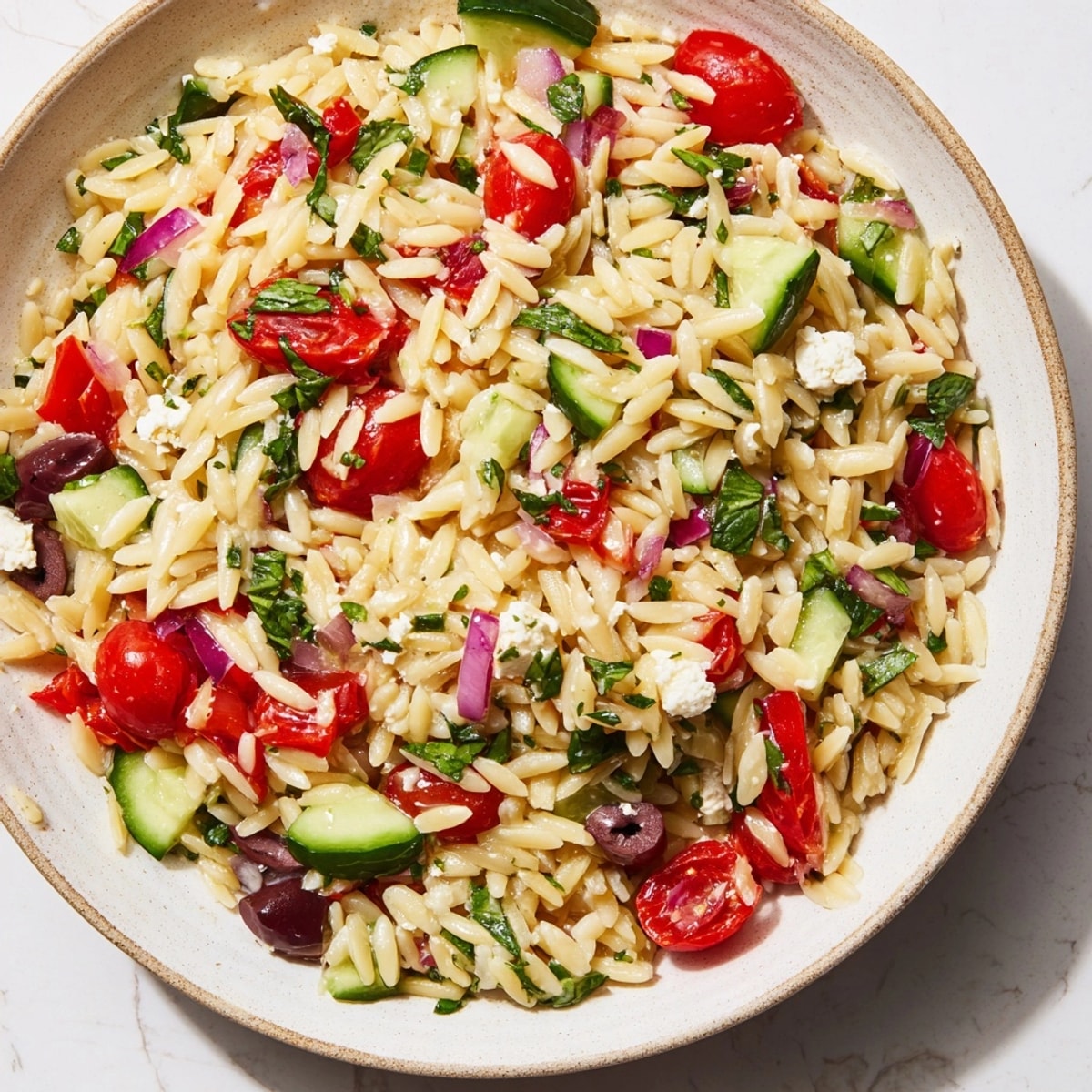 Freshly prepared Mediterranean Orzo Bowl, a quick and healthy dish perfect for lunch or dinner.