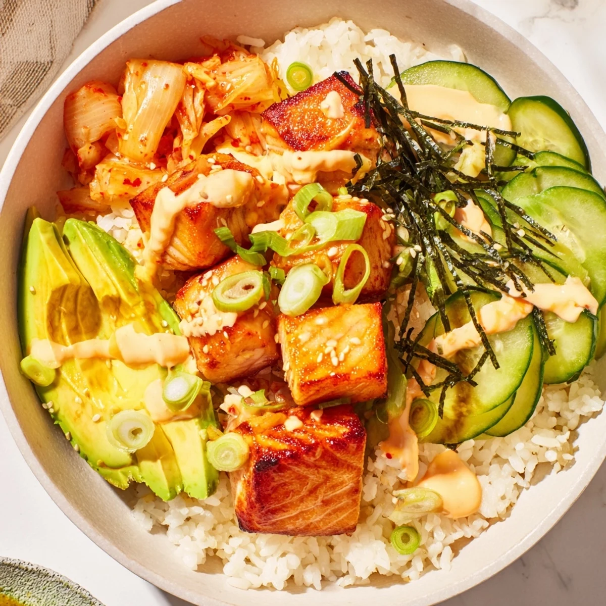 Vibrant Crispy Salmon Rice Bowl with fluffy rice, tangy kimchi, and crispy garlic.  