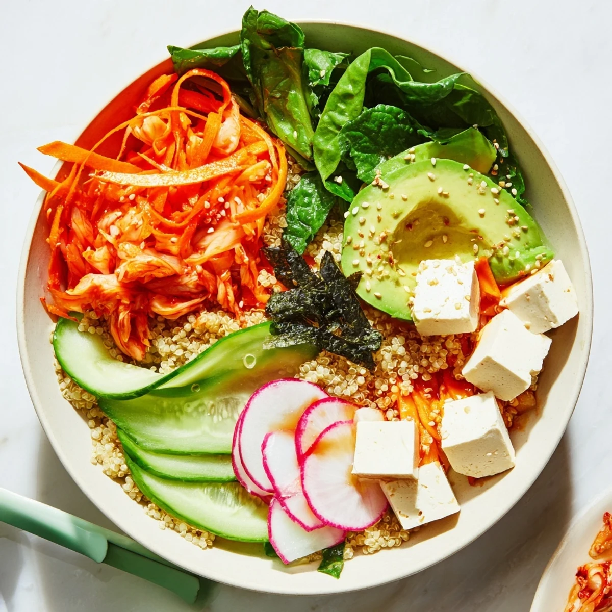 Vibrant fermented vegetable bowl with kimchi and fresh greens, perfect for lunch.  