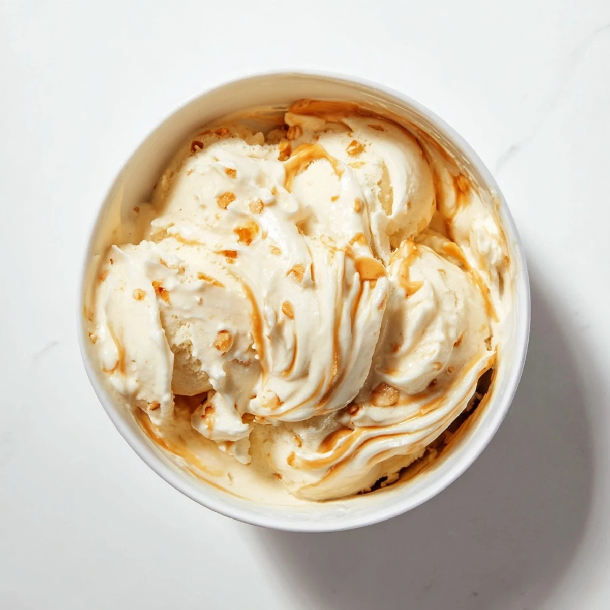 A close-up of creamy Peanut Butter Banana Ice Cream ready to be devoured, perfectly frozen.