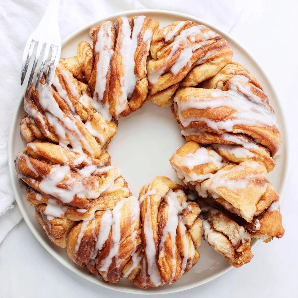 Imagine a pull-apart wreath of cinnamon rolls, generously glazed and sweet, right out of the oven.