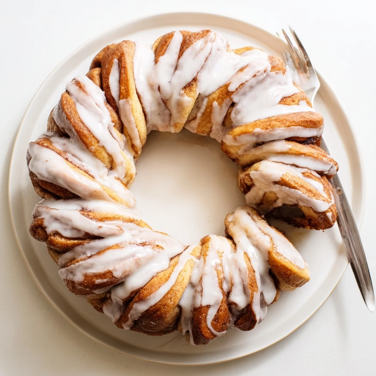This delicious Cinnamon Roll Pull-Apart Wreath features soft, fluffy rolls spiraled into a beautiful shape.