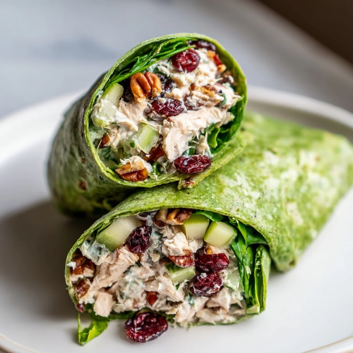 Festive Cranberry Pecan Chicken Salad Christmas Wrap, overflowing with juicy chicken, crunchy pecans, and cranberries.