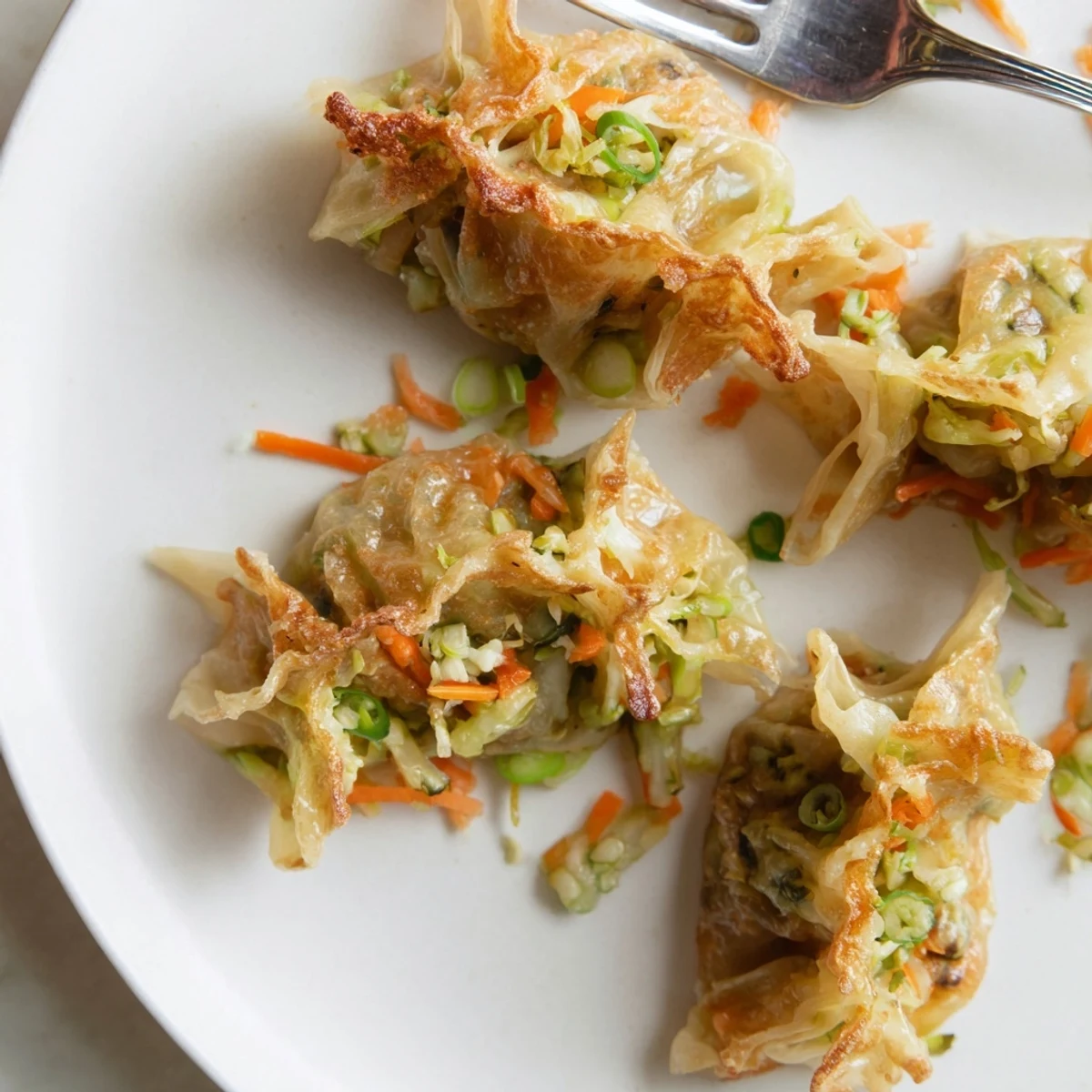 Golden-brown crispy rice paper dumplings, filled with savory veggie filling, ready to serve and enjoy.
