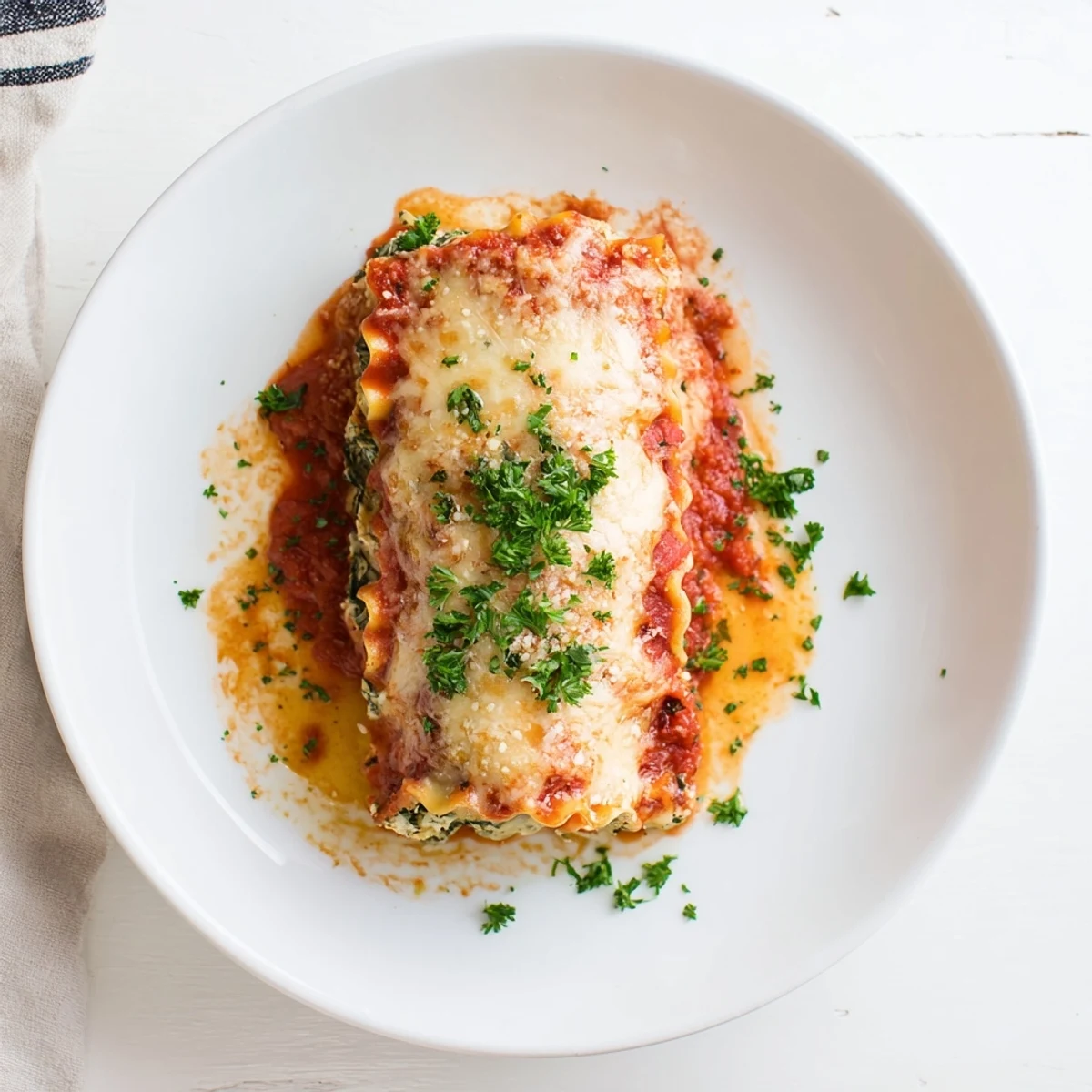 Golden-brown Chicken and Spinach Lasagna Rolls, rolled with creamy ricotta, fresh spinach, and shredded chicken, baked in marinara sauce for a hearty Italian-American dinner.