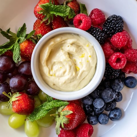 Fresh berries and rich cream cheese make this Mistletoe Kiss Berry Dip Board the perfect holiday treat.