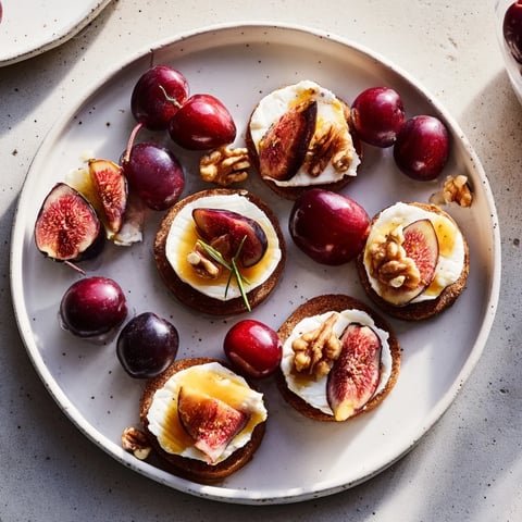 Midnight Orchard platter: vibrant dark cherries and creamy goat cheese, ready to serve as an elegant appetizer.