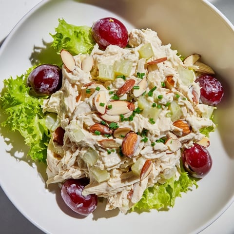 Creamy Crispy Chicken Salad with a bed of fresh greens and juicy red grapes, delicious!