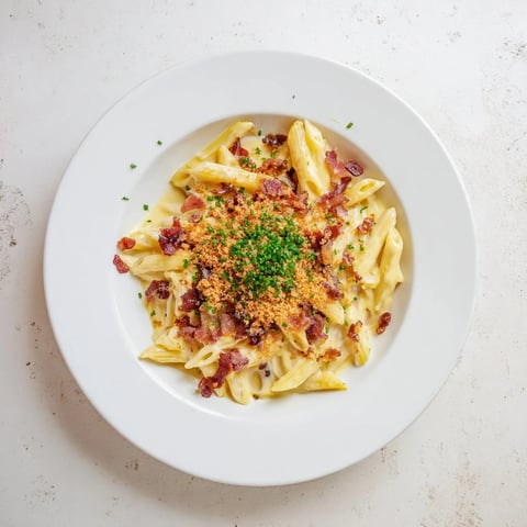 Creamy Jalapeño Popper Pasta with crispy bacon, roasted peppers, and melted cheddar in a rich sauce.