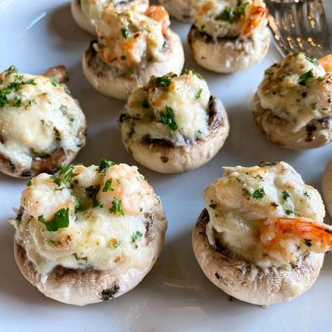 Close up of Shrimp Alfredo Stuffed Mushrooms: tender, cheesy, an elegant, easy appetizer.