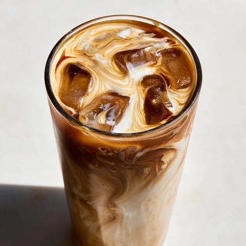 Nutty tahini iced coffee drizzled with sweetness for a refreshing summer treat.  