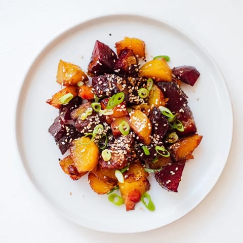 A glistening image of Miso Roasted Winter Vegetables, beautifully caramelized and ready to be served warm.