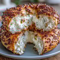 Golden cottage cheese bagels with a chewy crust and soft, fluffy interior, topped with everything bagel seasoning for a high-protein breakfast treat.