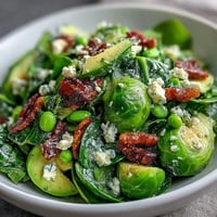 Bright Lemon Vinaigrette Spring Salad with crisp radishes and sweet peas, tossed in a zesty lemon dressing for a refreshing seasonal dish.